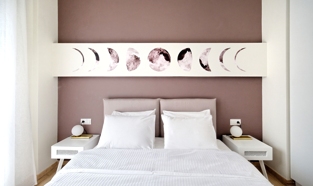 Wall-art graphics of the moon phases that decorate a themed hotel in Athens. Design by The Blank Sheep